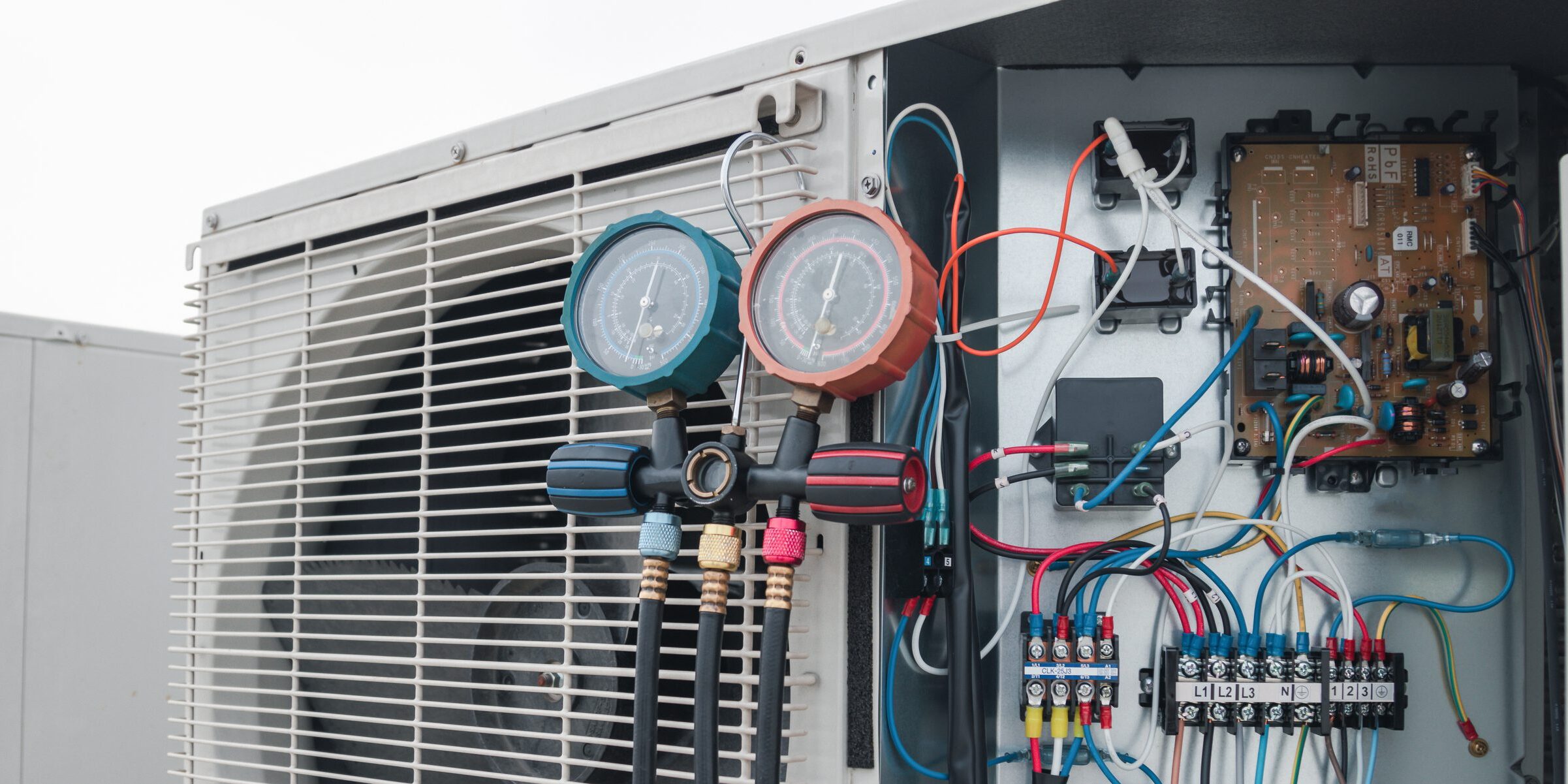 HVAC unit with manifold gauges and wiring