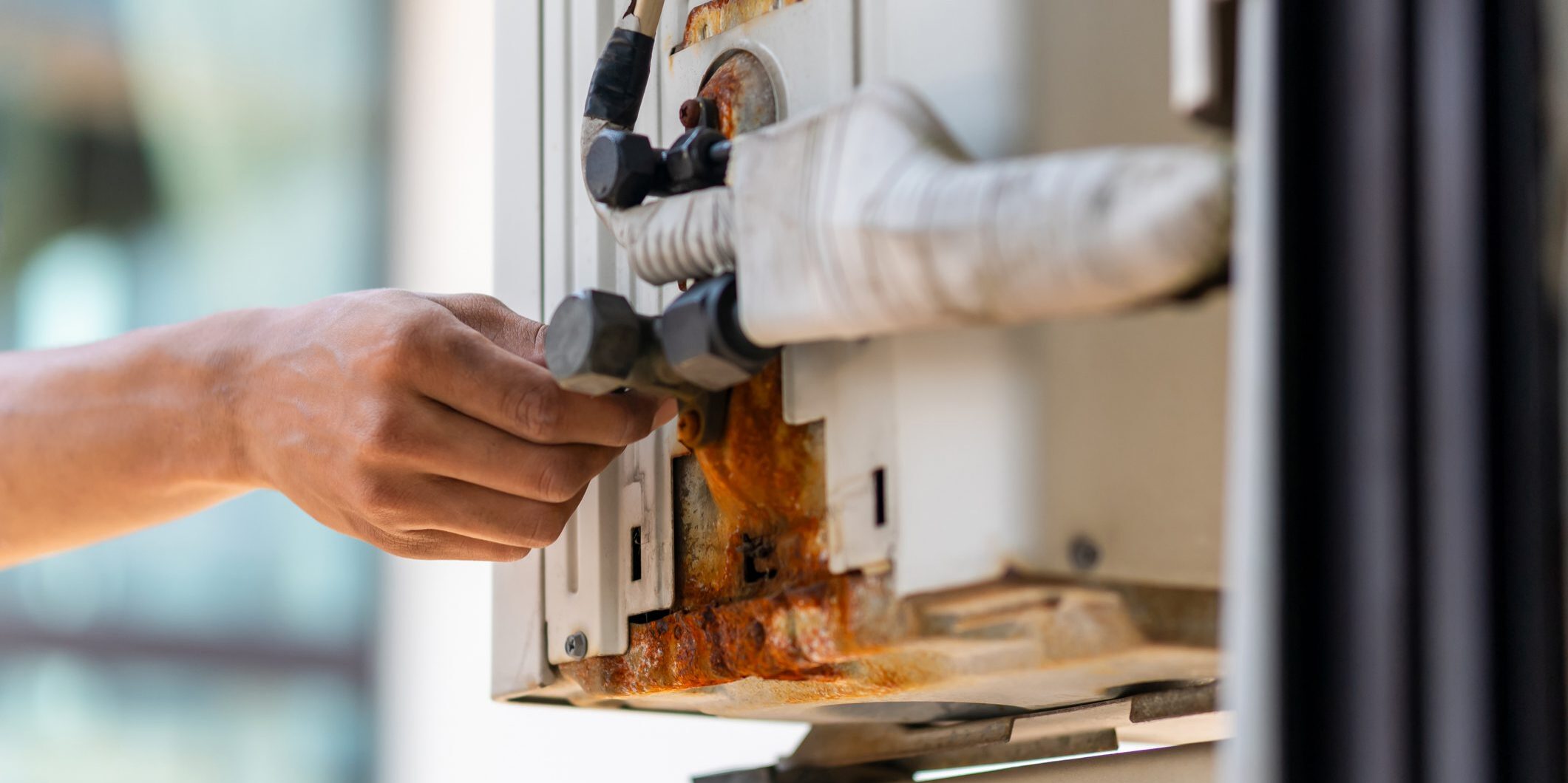 Hand adjusting outdoor air conditioner valve