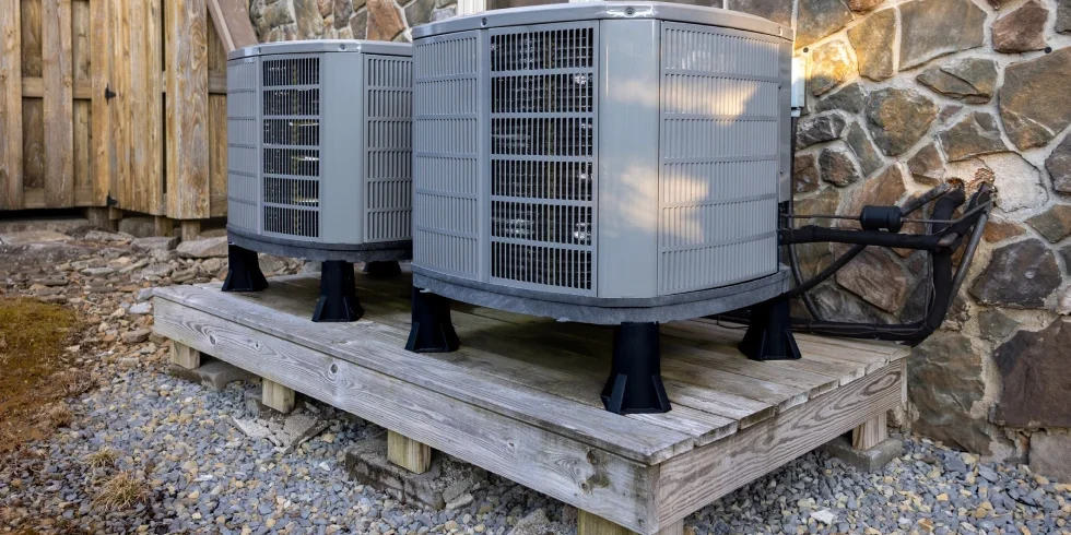 Outdoor HVAC units on wooden platform
